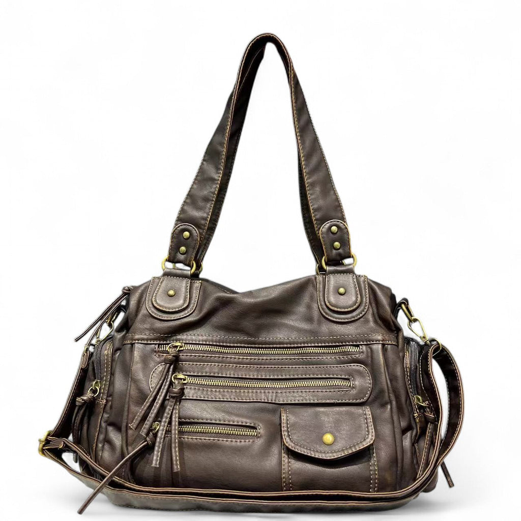 Sac à main en cuir marron avec multiples poches zippées et bandoulière ajustable. Élégant et pratique pour un usage quotidien. Accessoire mode femme.
