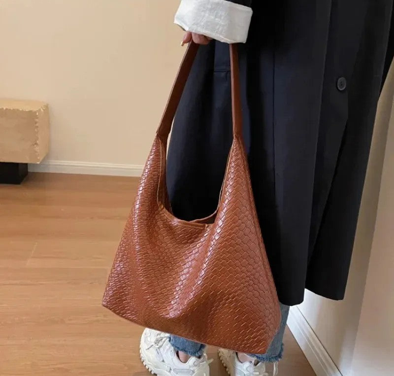 Black leather handbags and satchel for women, elegant and functional