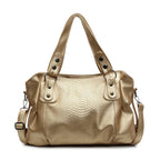 Sac à main en cuir doré avec motif serpent, anses robustes et bandoulière amovible. Élégant et tendance, idéal pour la mode féminine.
