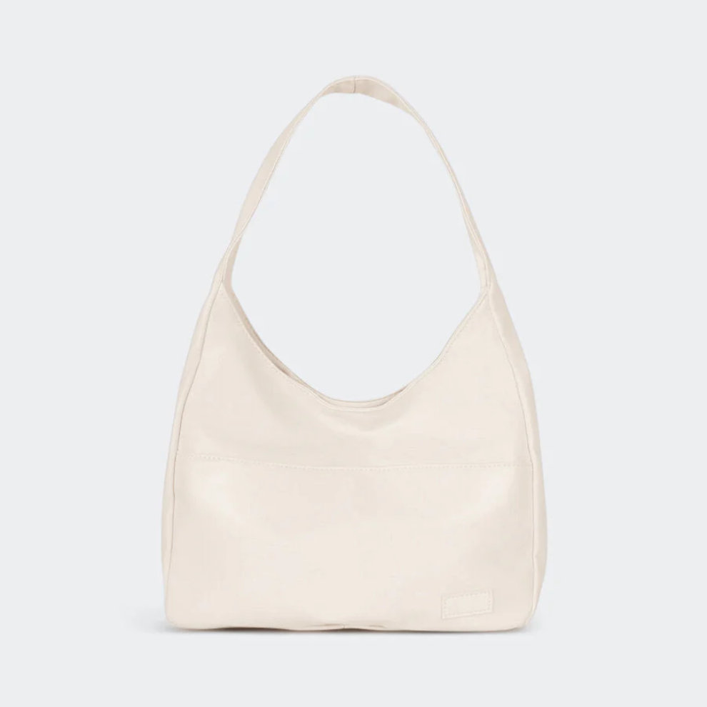 Sac à main en cuir beige minimaliste avec anse unique, design élégant et moderne, parfait pour un usage quotidien ou une tenue chic.