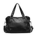 Sac à main noir en cuir texturé, design élégant avec poignées renforcées et bandoulière amovible. Accessoire mode femme chic et tendance.