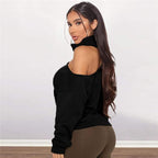 Long-sleeved turtleneck sweater with one exposed shoulder