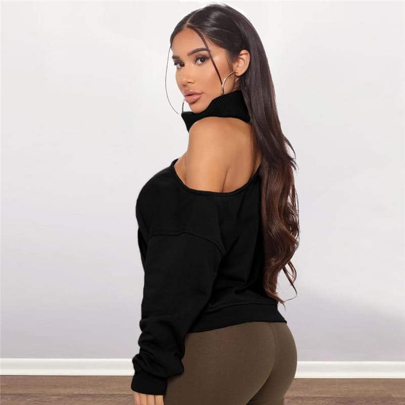 Long-sleeved turtleneck sweater with one exposed shoulder