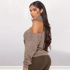 Long-sleeved turtleneck sweater with one exposed shoulder