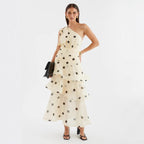 Asymmetrical polka dot dress with openwork details