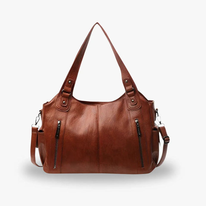 Sac à main en cuir marron avec bandoulière amovible, deux poches zippées à l'avant, design élégant et moderne, parfait pour femme.