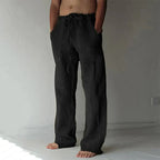 Pantalon ample noir en lin pour homme, taille élastique, poches latérales, style décontracté, idéal pour l'été et les tenues décontractées.