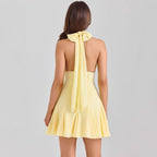 Mini robe jaune dos nu encolure plongeante