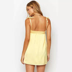 Yellow satin mini dress with straps and zipper closure