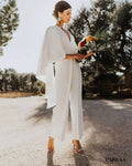 Wedding outfit with a cape