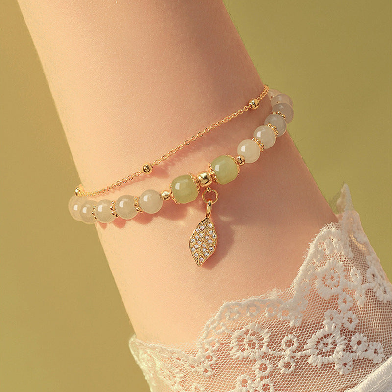 Chinese beaded bracelet with leaf pendant