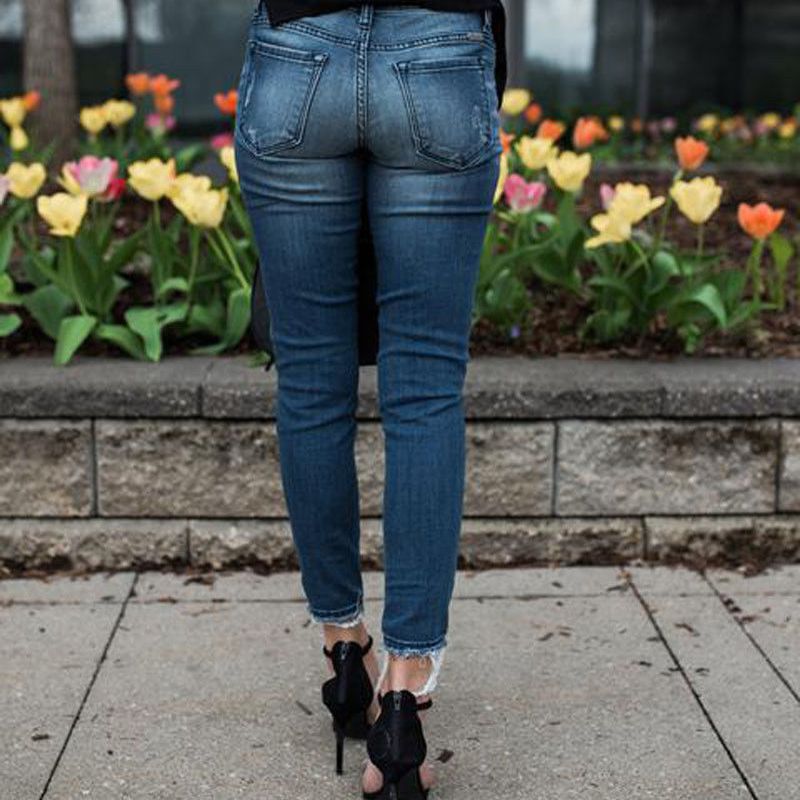 Jeans skinny déchirées à plis