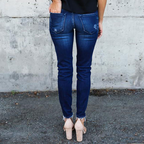Jeans skinny déchirées à plis