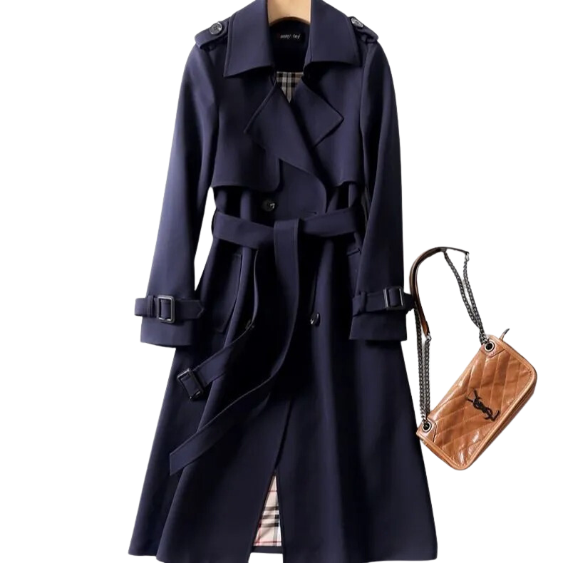 Manteau trench-coat bleu marine élégant avec ceinture, boutons et détails épaulettes, accompagné d'un sac à main en cuir marron. Mode automne chic.