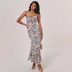 Robe longue fluide à motifs floraux et ceinture cintrante
