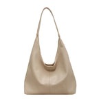 Sac à main beige en cuir, design minimaliste, bandoulière longue, style élégant et moderne, accessoire mode femme, tendance 2023.