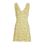 Jupe patineuse jaune dos nu, taille resserrée