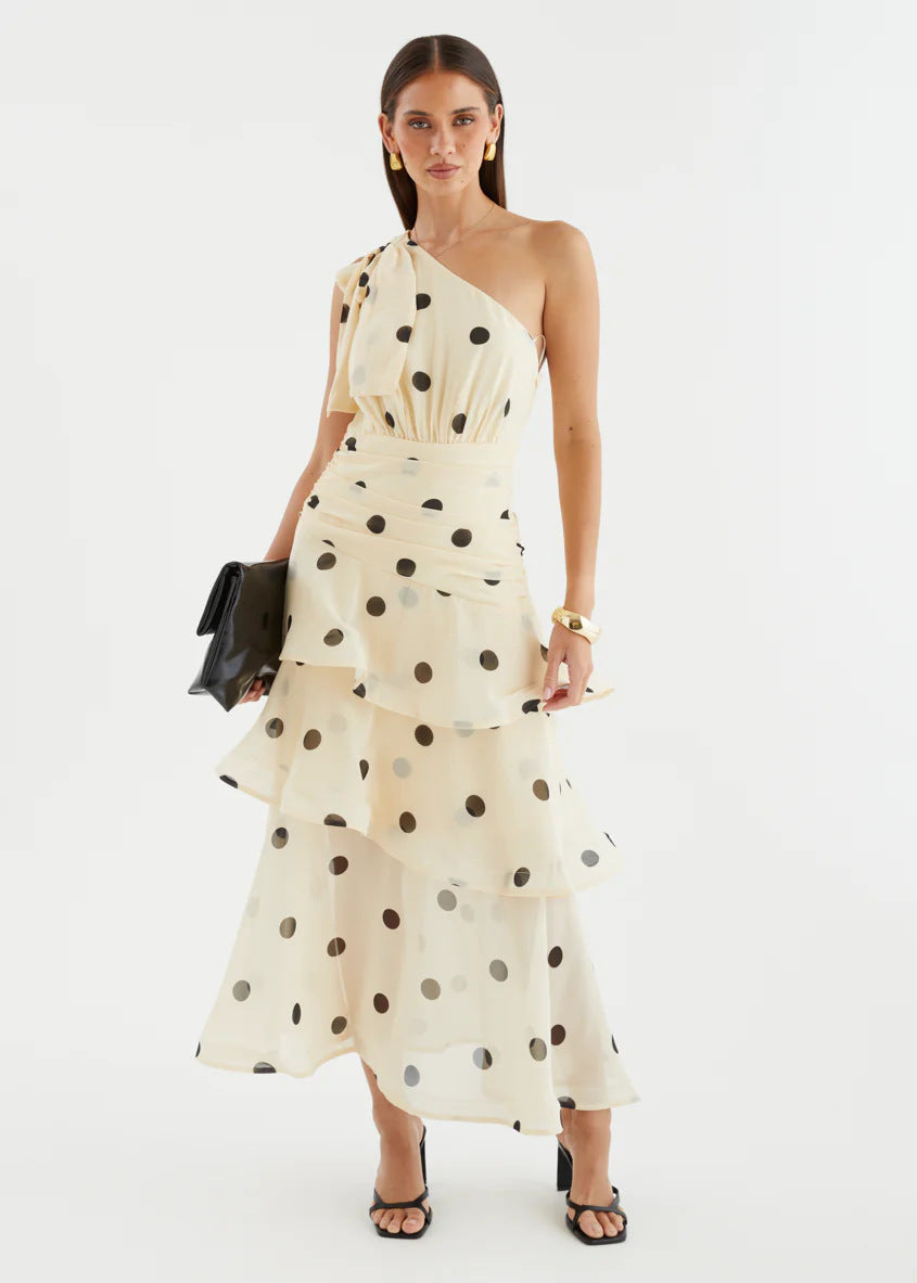 Asymmetrical polka dot dress with openwork details