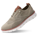 Chaussure de sport beige en maille respirante avec semelle blanche épaisse, lacets assortis et détails marron, idéale pour le confort et la mode.