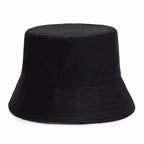 Chapeau bob noir en tissu, design classique et minimaliste, idéal pour la mode urbaine et les tenues décontractées. Accessoire tendance et polyvalent.