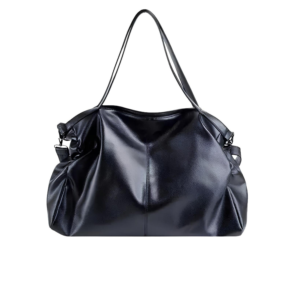 Sac à main en cuir noir élégant avec anses longues, design moderne et spacieux. Accessoire mode femme, idéal pour un look chic et sophistiqué.