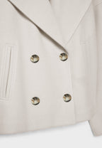 Manteau court pour femme avec double rangée de boutons et design intemporel