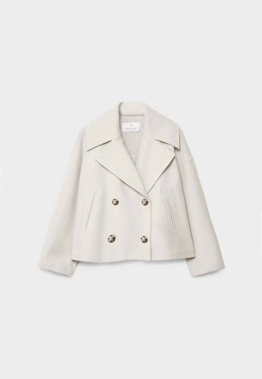 Manteau court pour femme avec double rangée de boutons et design intemporel