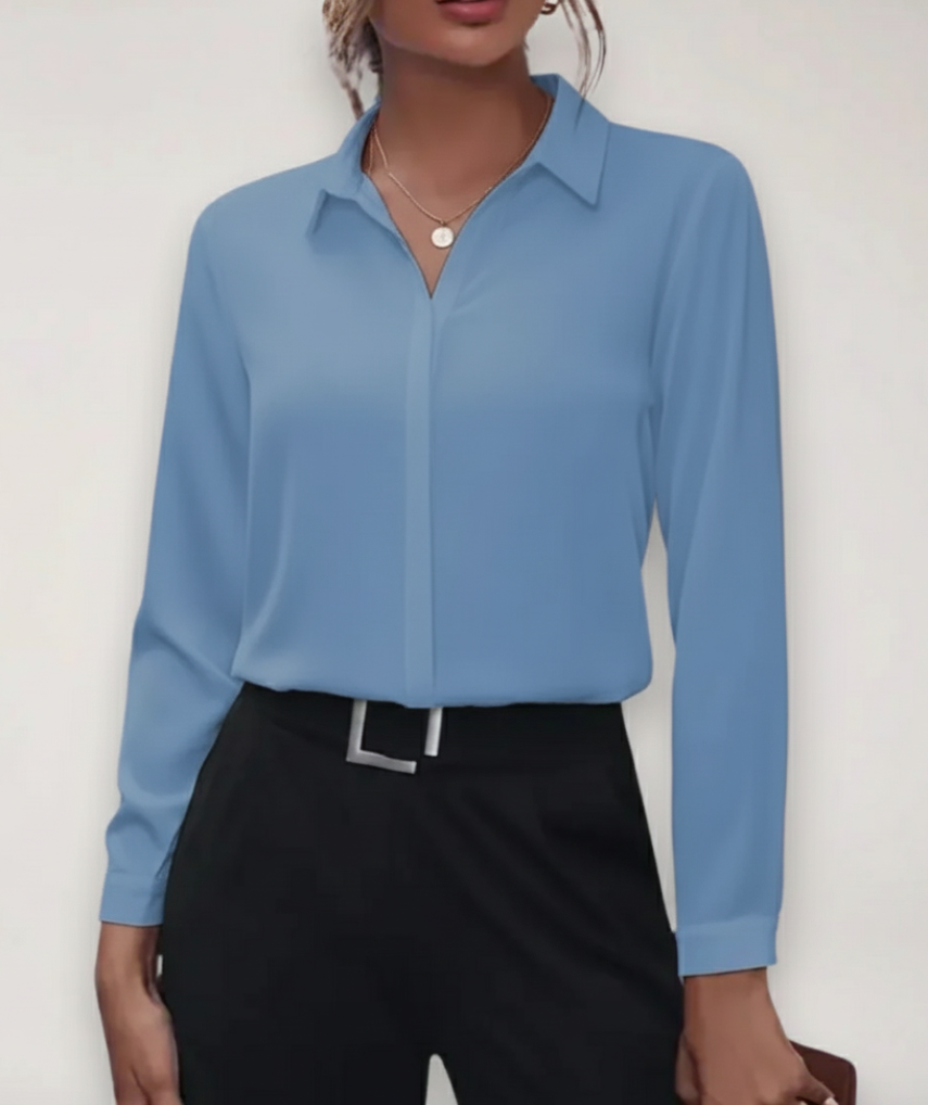 Women's tailored blouse with button placket, ideal for office wear.