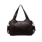 Sac à main en cuir noir élégant avec bandoulière réglable, poches zippées, design moderne. Accessoire mode femme, tendance et pratique.