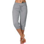 Pantalon de jogging gris pour femme, taille élastique avec cordon, coupe trois-quarts, confortable et décontracté, idéal pour le sport et la détente.