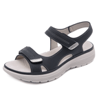 Sandale noire en cuir pour femme avec semelle épaisse antidérapante, fermeture velcro, design confortable et moderne, idéale pour l'été.