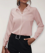 Women's tailored blouse with button placket, ideal for office wear.