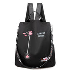 Sac à dos noir élégant avec broderie florale rose, texte "Lovely FDM", bretelles ajustables et poignée supérieure. Accessoire mode femme tendance.