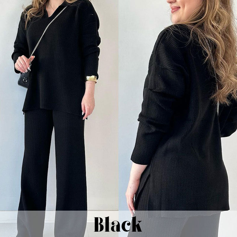 Femme portant un ensemble noir élégant, composé d'un pull ample et d'un pantalon large. Mode automne-hiver, tenue chic et confortable.