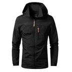 Veste imperméable noire avec capuche, fermeture éclair et poches zippées, idéale pour randonnée et activités extérieures. Style moderne et fonctionnel.