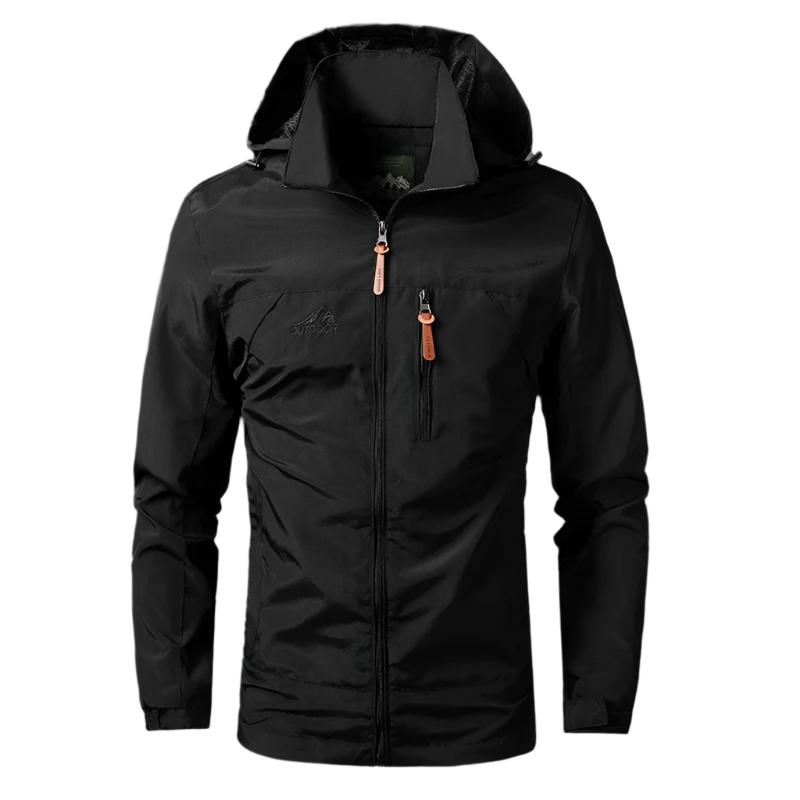Veste imperméable noire avec capuche, fermeture éclair et poches zippées, idéale pour randonnée et activités extérieures. Style moderne et fonctionnel.