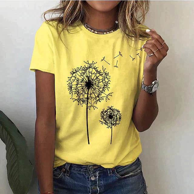 Femme portant un t-shirt jaune avec motif de pissenlit noir, style décontracté, mode tendance, montre argentée, collier moderne.